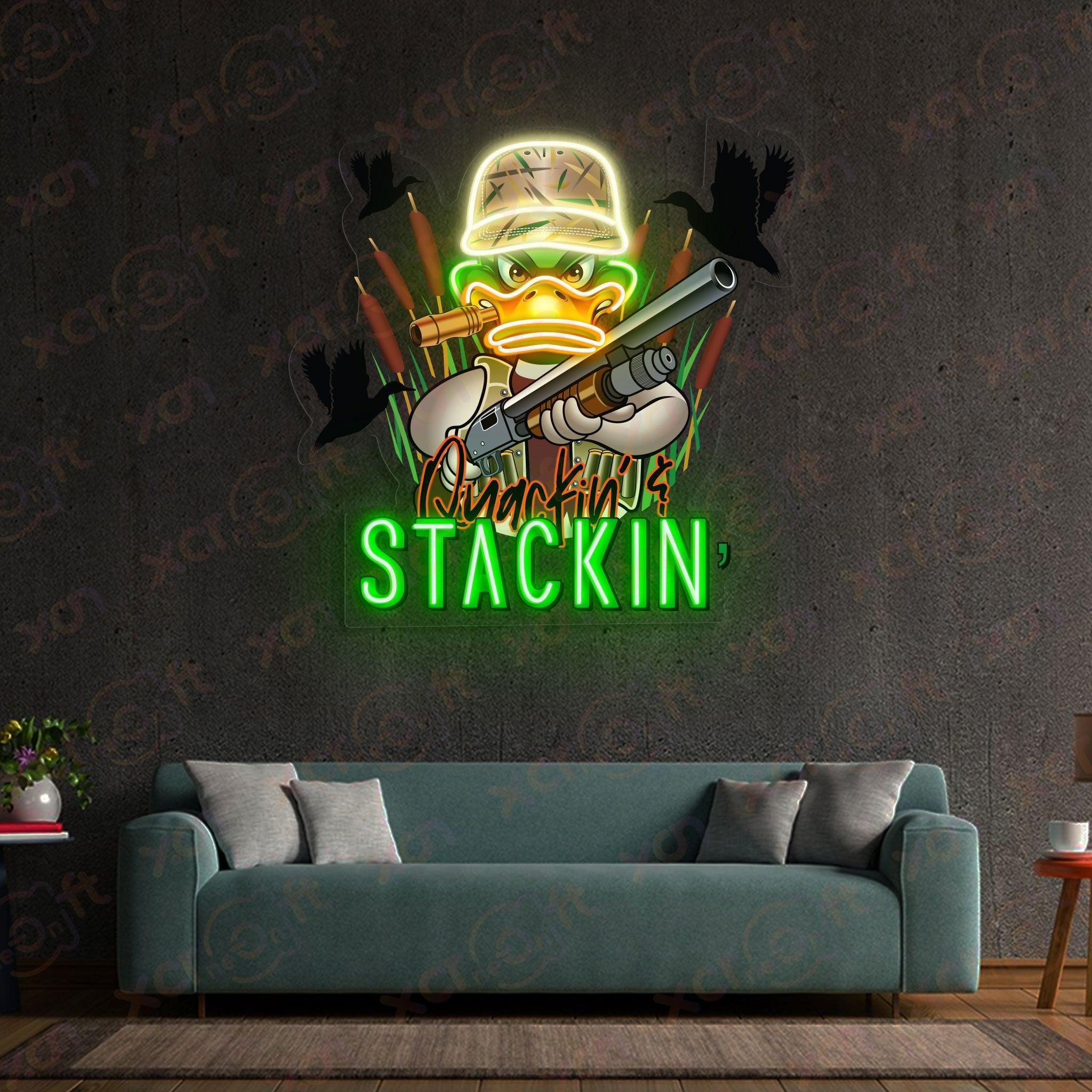 "Quackin' Stackin'" logo duck holding shotgun.